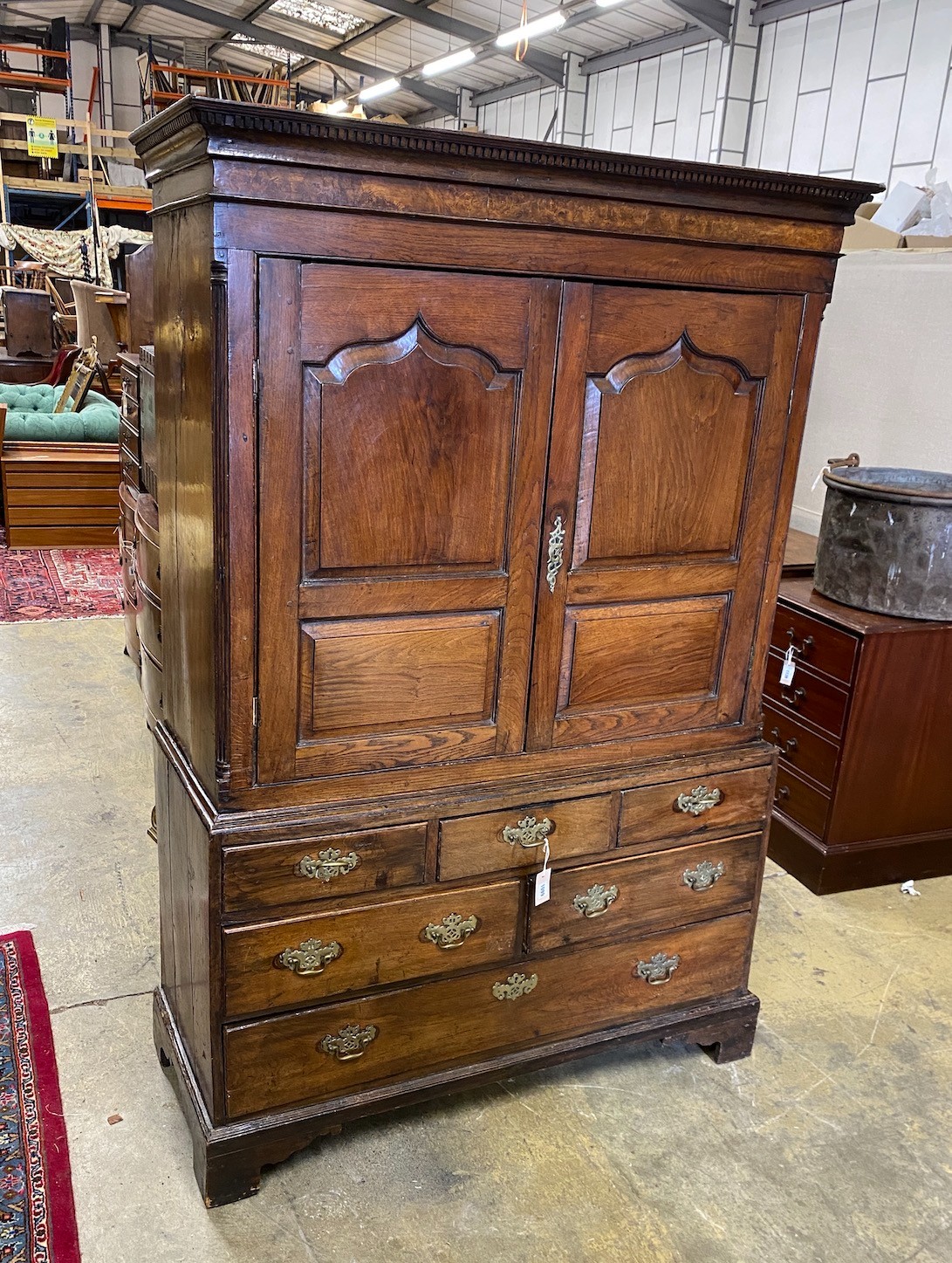 A small 18th century oak press cupboard, width 121cm, depth 51cm, height 182cm